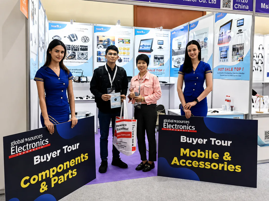 SuperPower team and visitors at an automotive electronics exhibition booth