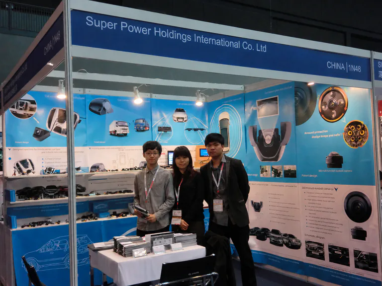 SuperPower team at a branded vehicle camera exhibition booth