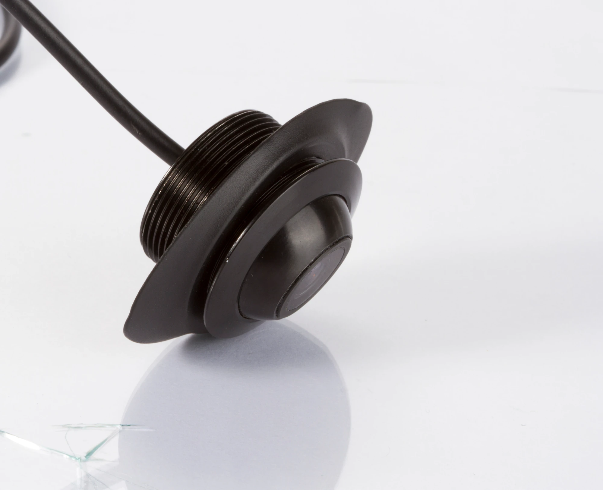 Angled view of the CAM-EYE02 camera showing the threaded housing and eyeball lens