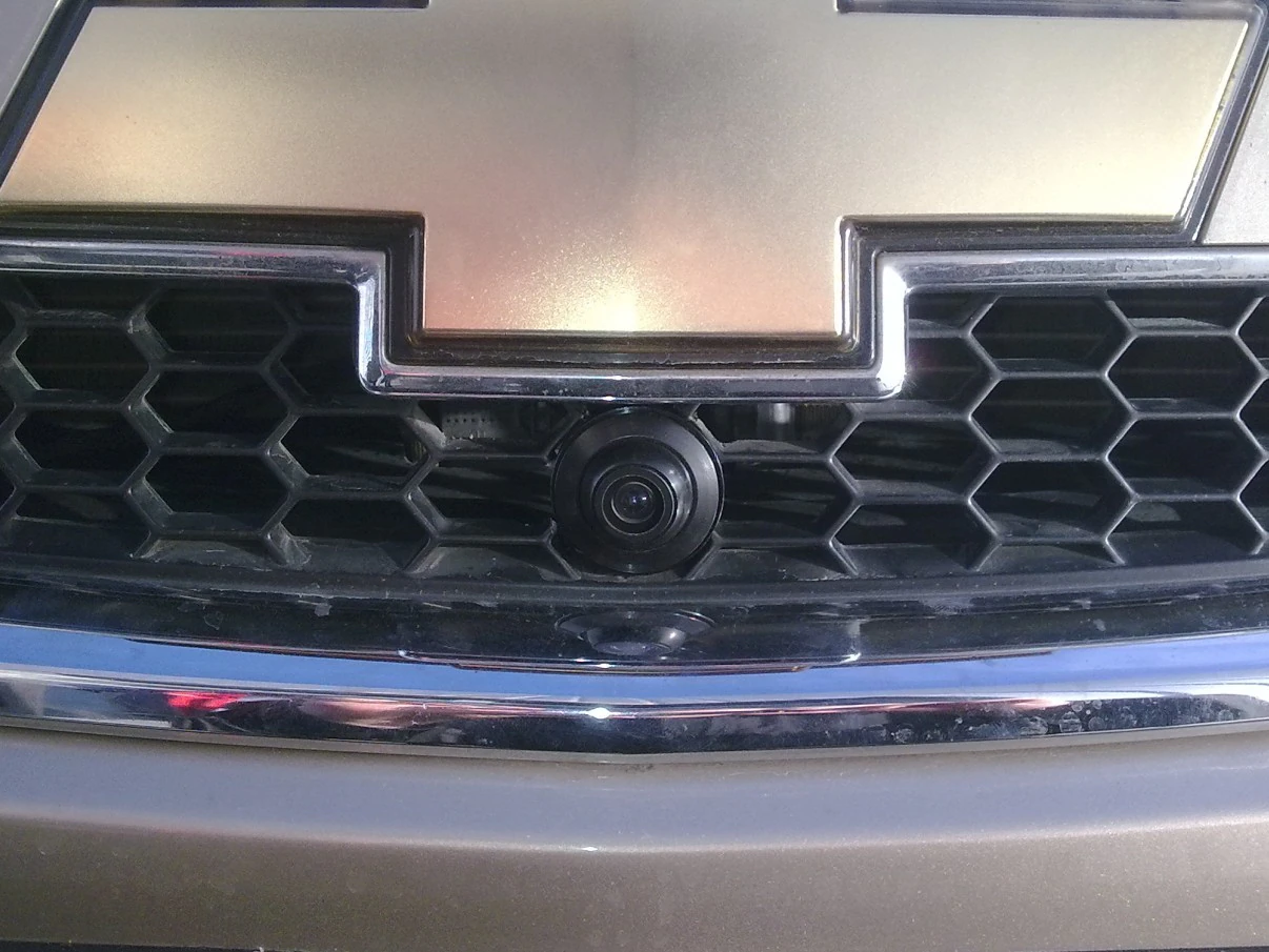 CAM-EYE02 camera installed in the front grille of a passenger vehicle