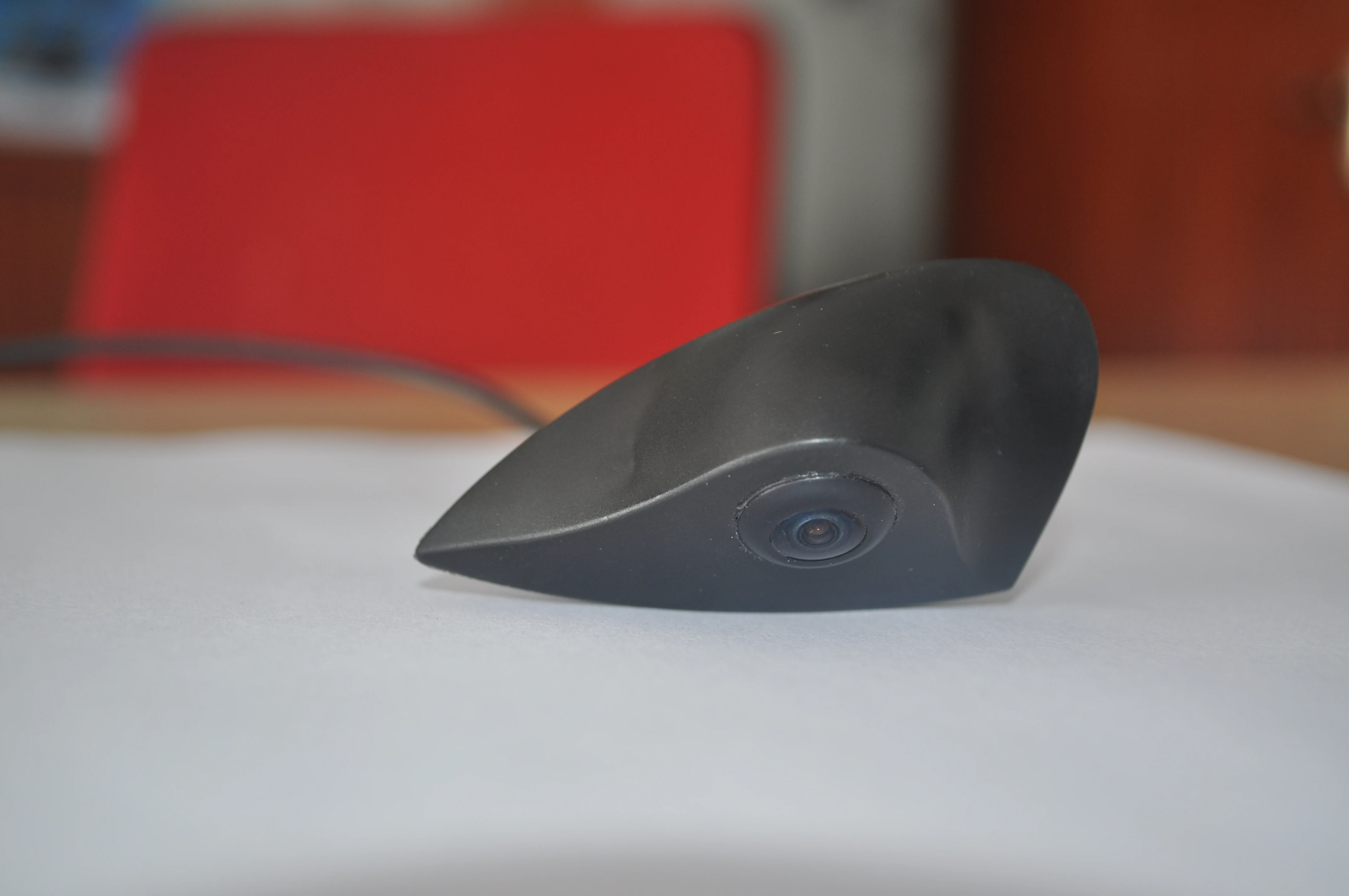 Close front view of the CAM-FH01 Hyundai logo camera lens and curved housing