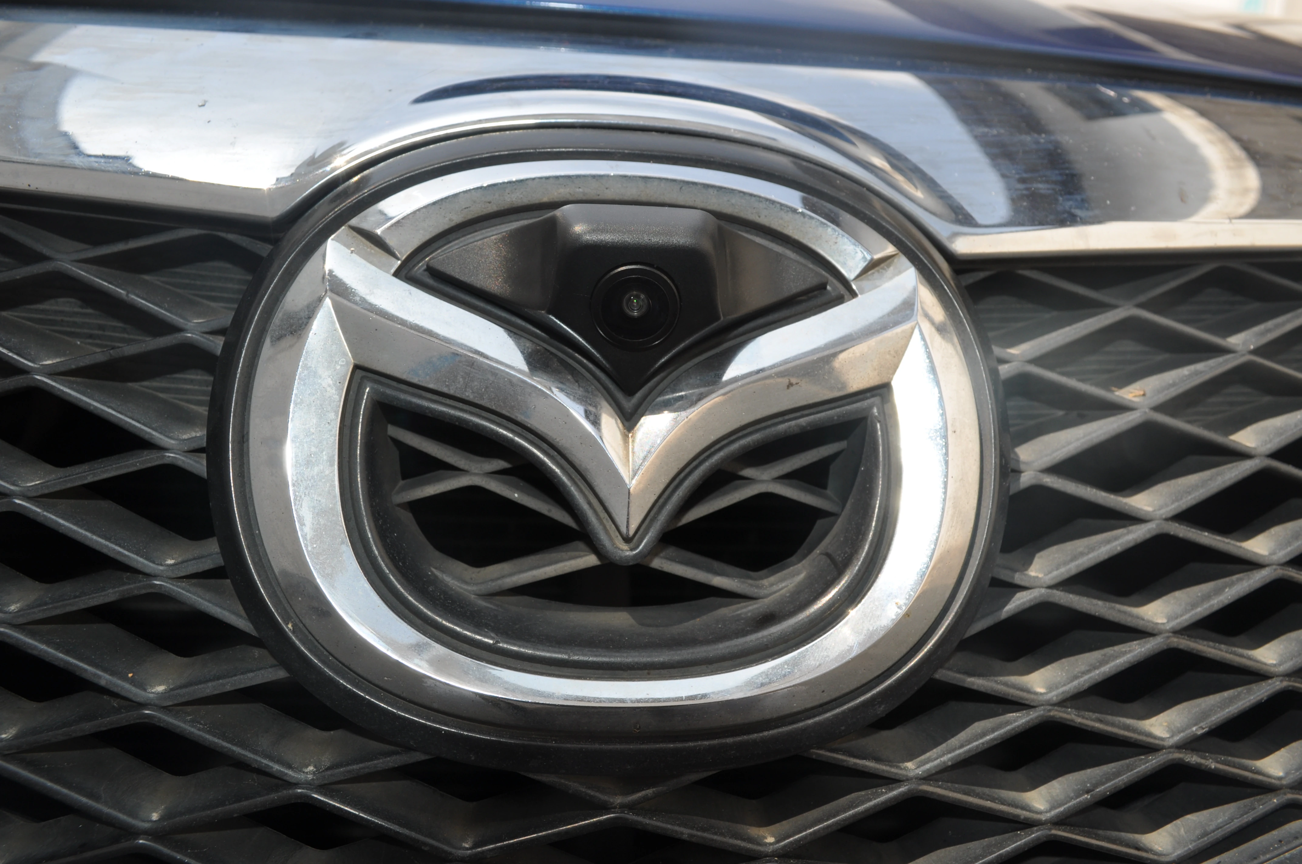 CAM-FM01 front camera installed in a Mazda grille emblem