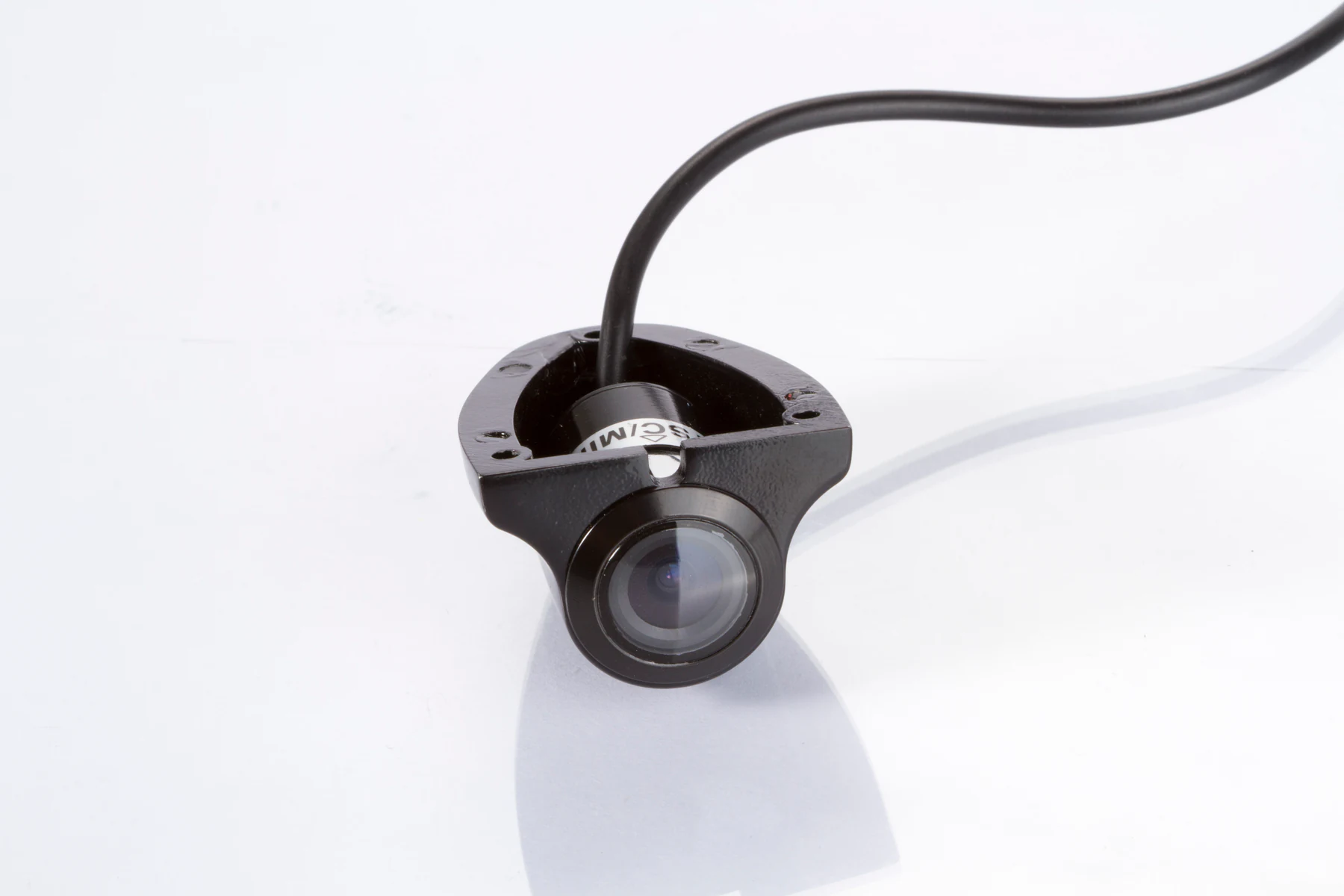 Rear angled view of the CAM-ST01 camera showing its cable exit and mounting base